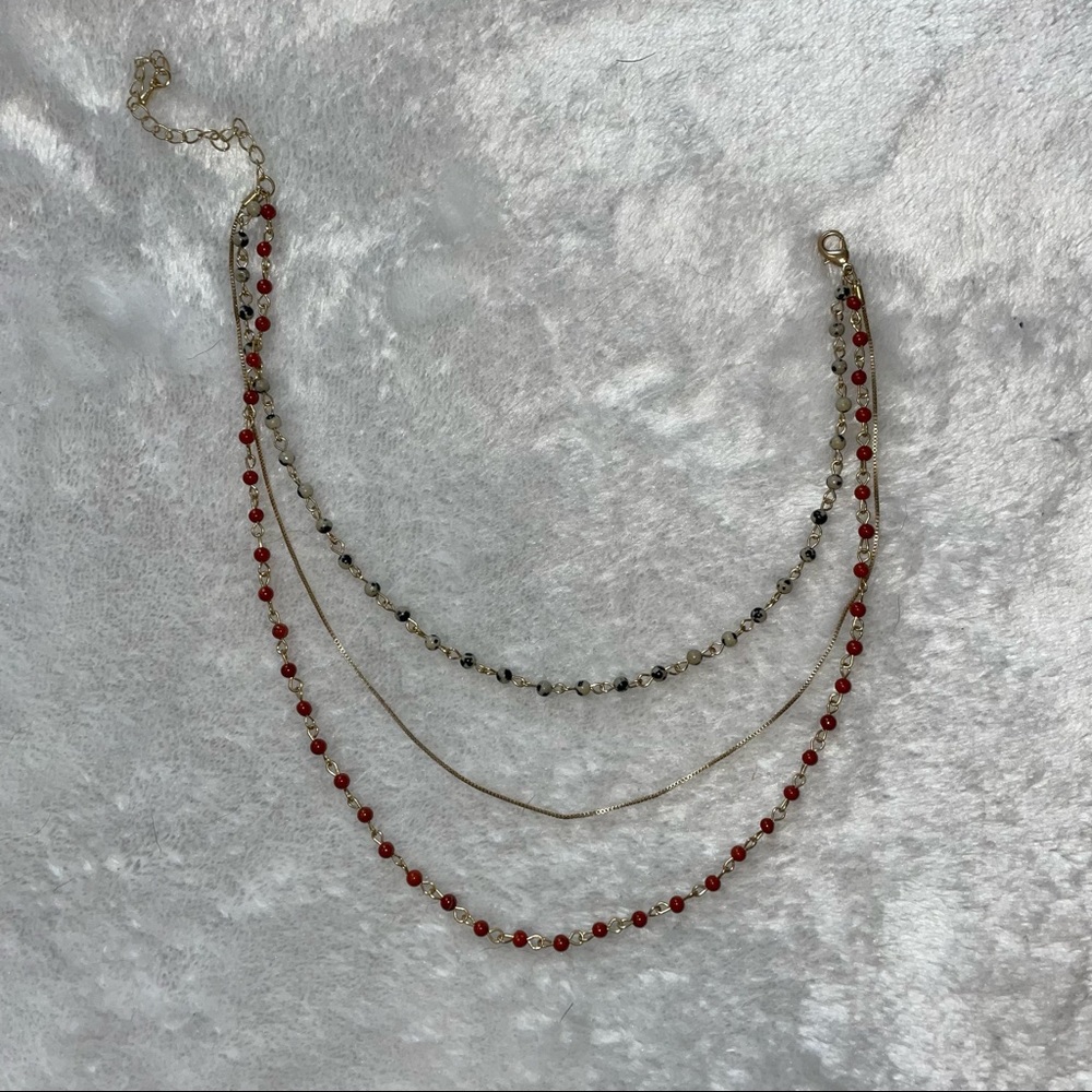 Gold and marbled beaded necklace